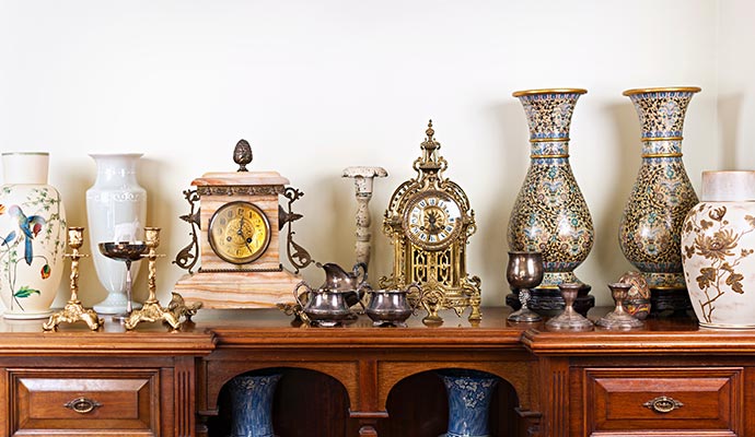 A collection of restored antique items displayed on a wooden table