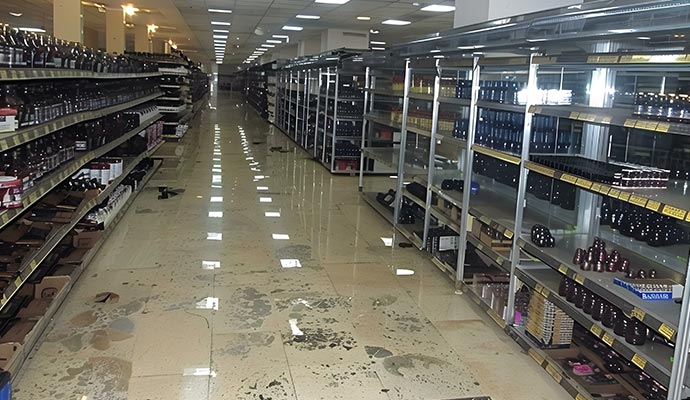 Retail store aisle with standing water on the floor