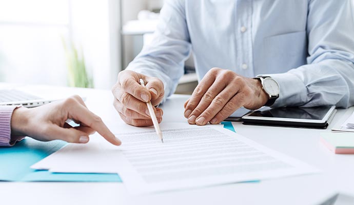 Insurance agent discussing policy details with client