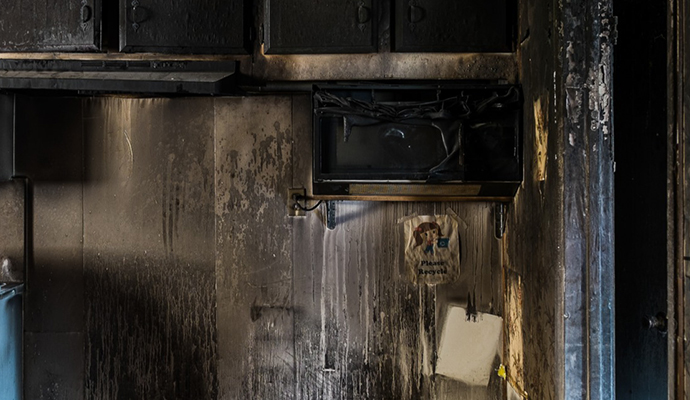 Soot and smoke damage on kitchen interior wall