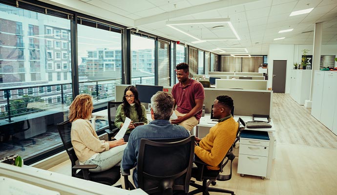 Employees having discussion in clean commercial space