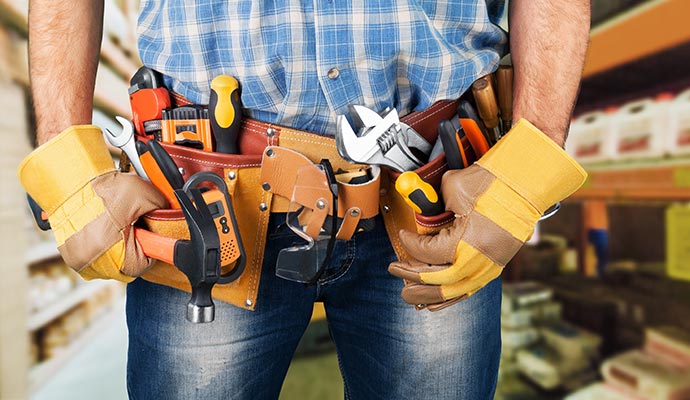 Handyman wearing a tool belt filled with tools