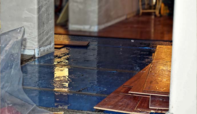 Water damage on a floor with wooden planks